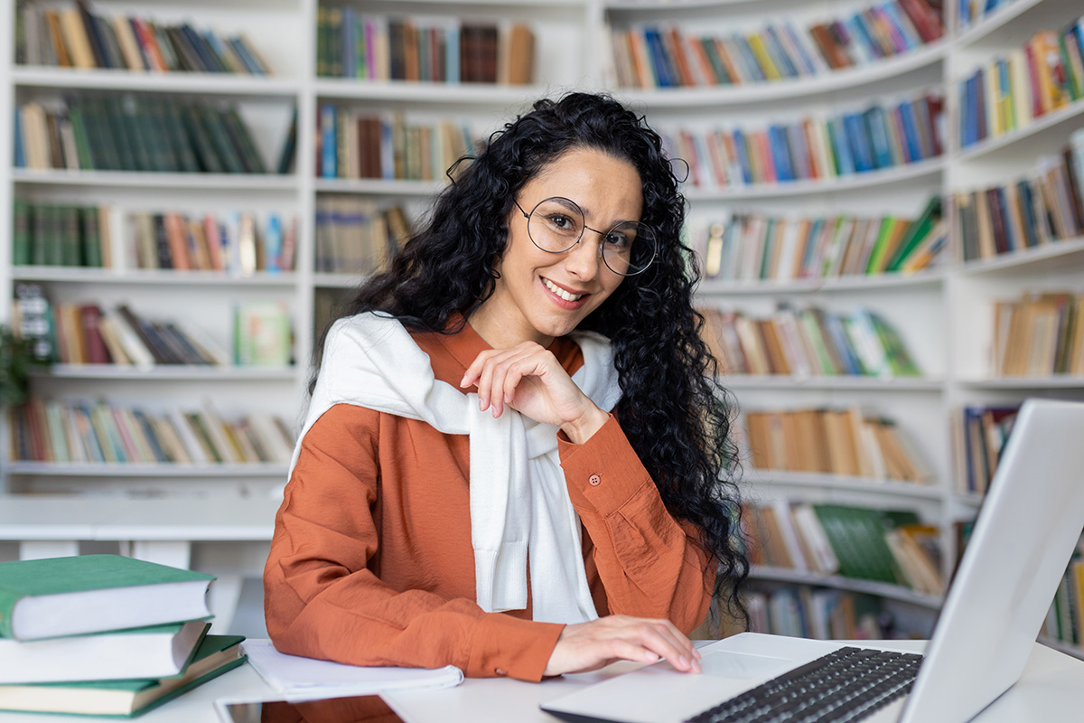 Female scholar researching ancient manuscripts for an article to be published in Biblica et Patristica Thoruniensia